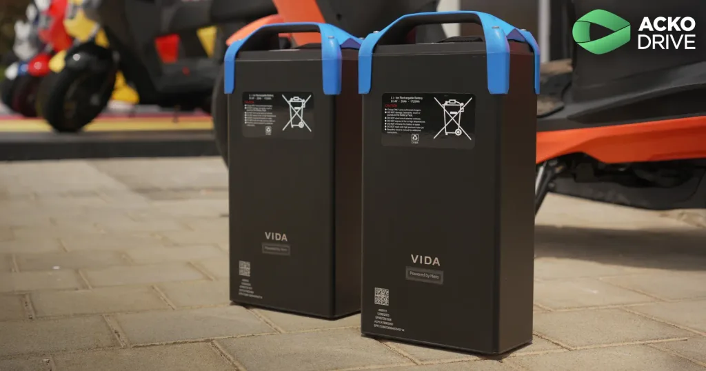 Vida V2 Plus removable battery being carried into apartment for indoor charging